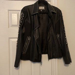 Tasha Polizzi leather and metal biker jacket
